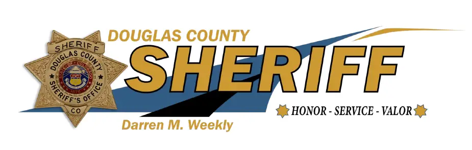 Douglas County Sheriff’s Office logo featuring a sheriff badge, the text “DOUGLAS COUNTY SHERIFF,” “Darren M. Weekly,” and the words “Honor - Service - Valor” is displayed on the Mobile Command Center vehicle.