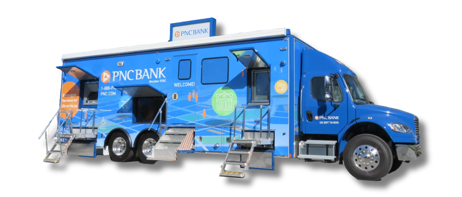 A blue PNC Bank mobile banking truck with three entry doors, stairs, and promotional graphics, parked and set up for customer access.