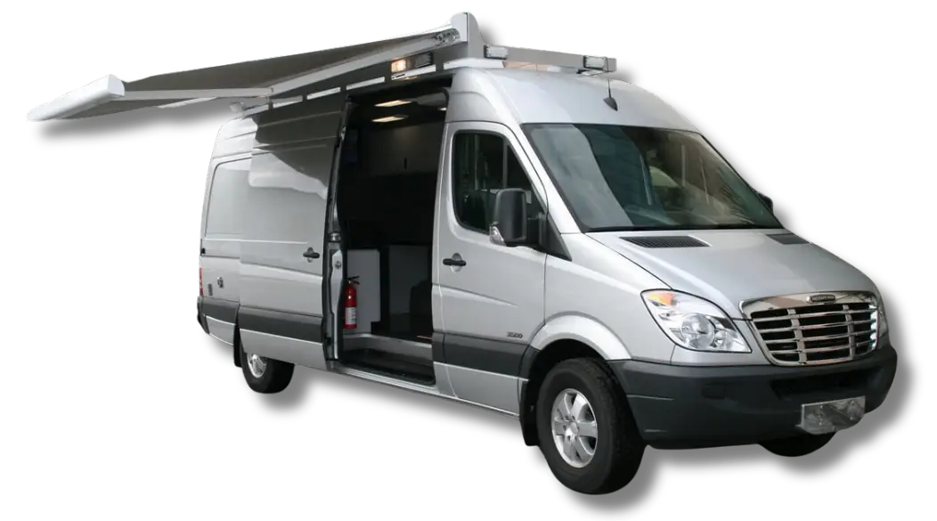 A silver Light Duty Sprinter van with an extended roof awning, sliding side door open, and visible interior features—including a fire extinguisher—is parked on a plain background.