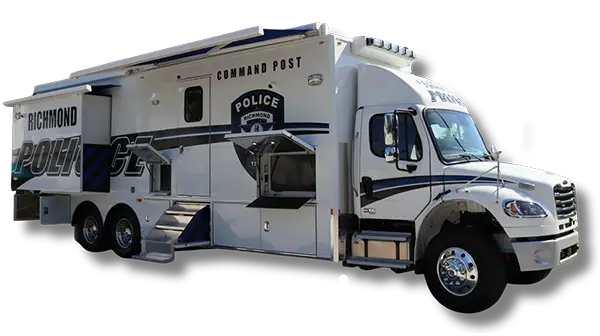 A large white police command post vehicle with Richmond KY Police Department written on the side, multiple compartments, stairs leading to an entry door, and emergency lights on the roof.